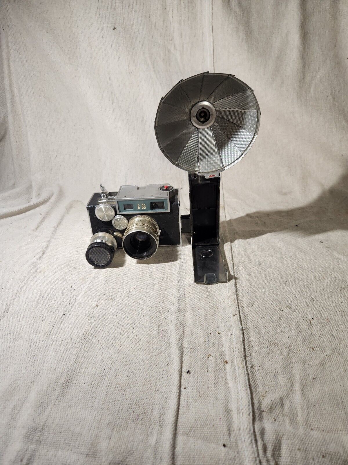 Vintage Argus C-33 Camera with flash attachment and documents