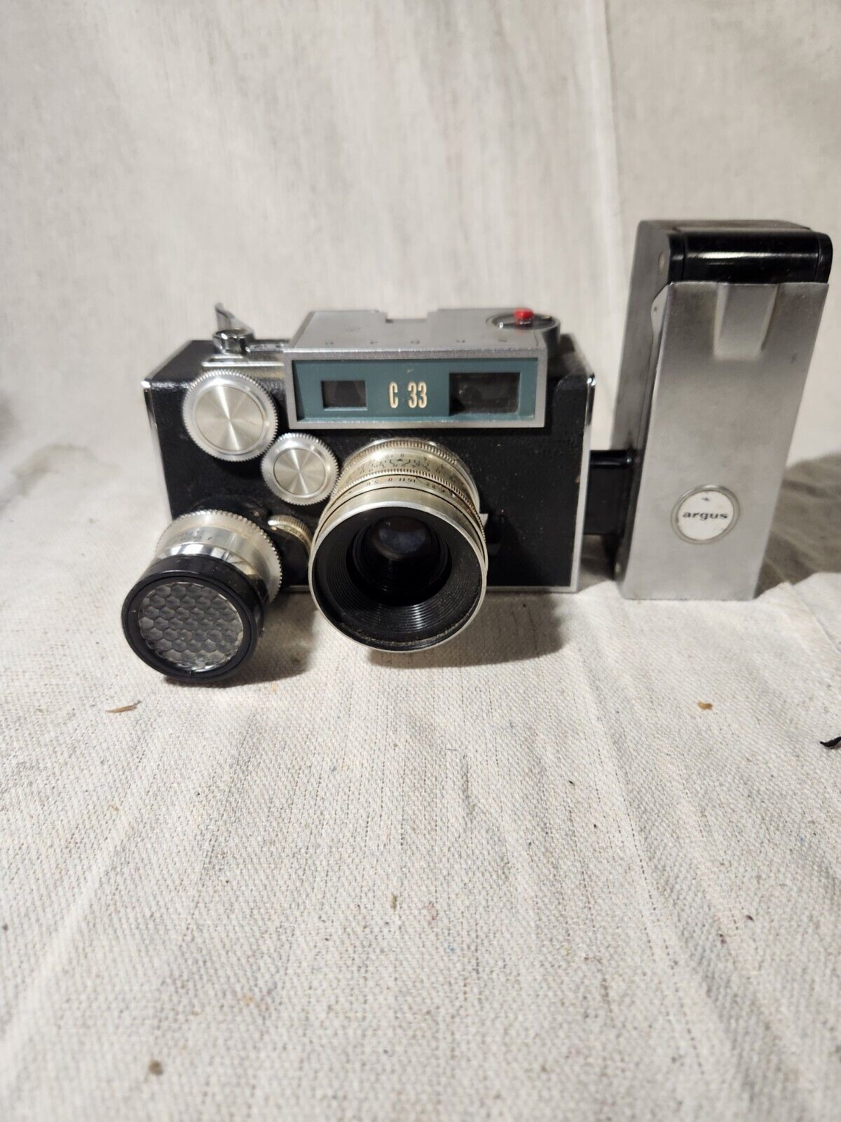 Vintage Argus C-33 Camera with flash attachment and documents