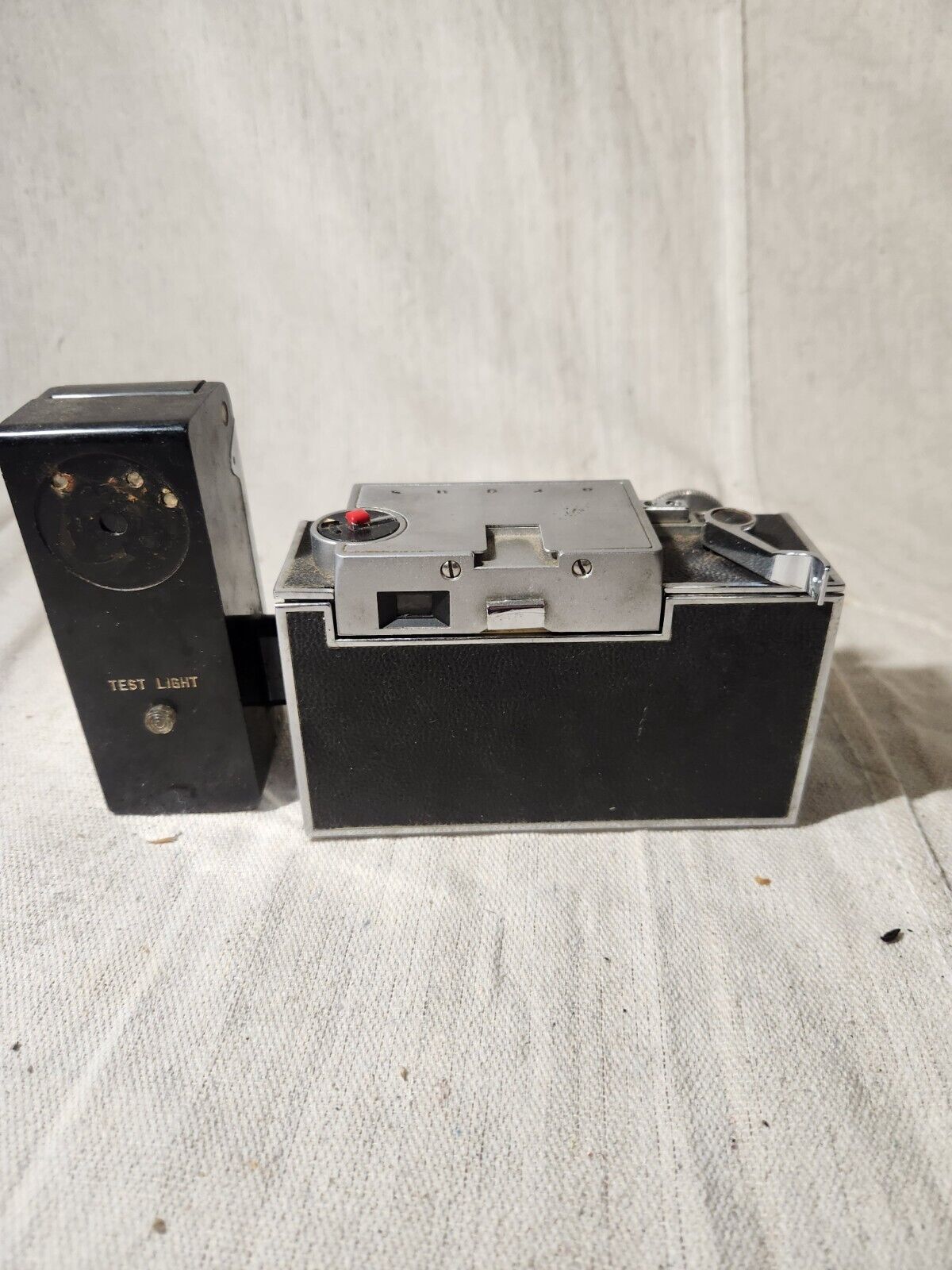 Vintage Argus C-33 Camera with flash attachment and documents