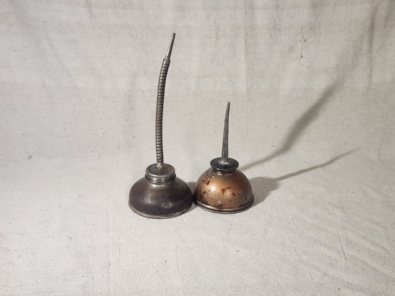 Two Vintage Oil cans one eagle brand, one flexible nozzle