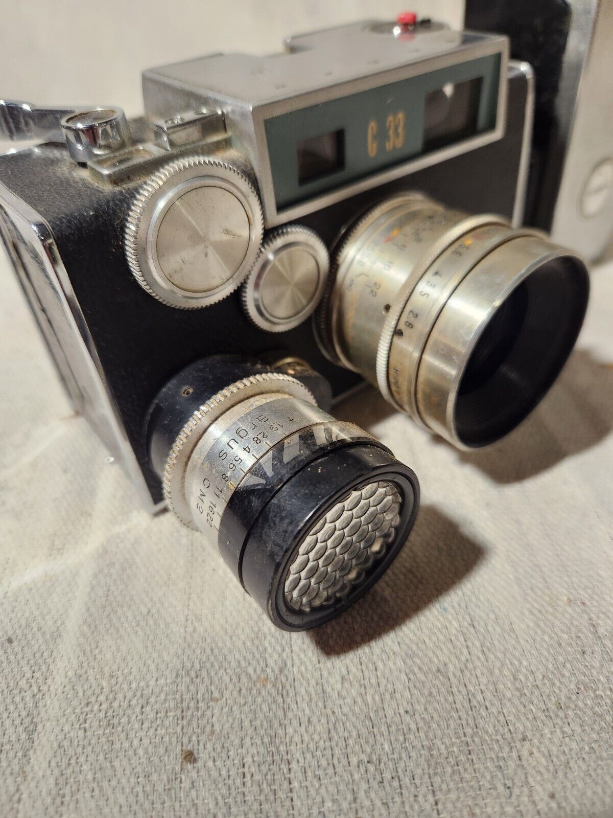 Vintage Argus C-33  Camera with flash attachment and documents